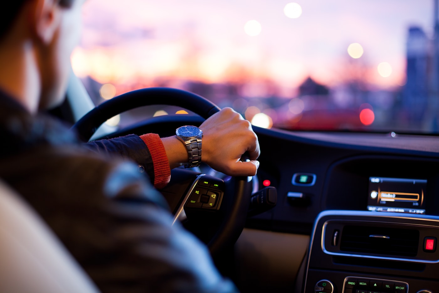 Driver on an open American highway with scenic landscape
