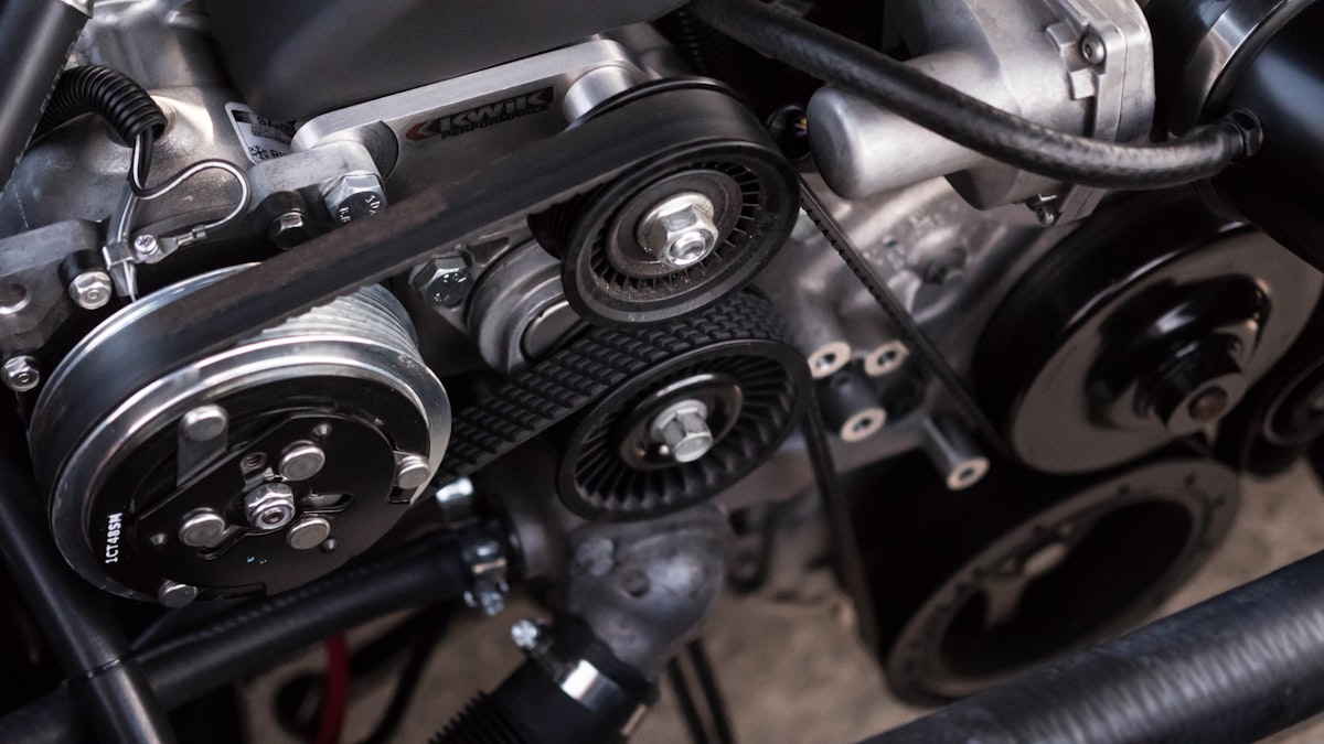 Professional mechanic inspecting a vehicle engine